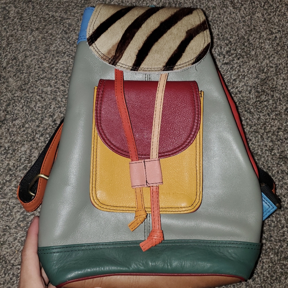 Gray and Red Fashion-Forward Backpack with Eclectic Design